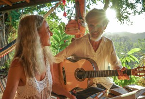 couple smiling and singing playing music in the sun